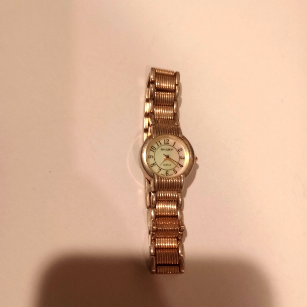 Sharp Gold Watch